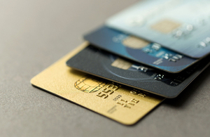 a stack of credit cards on a table
