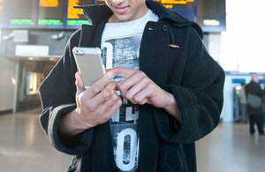 Picture of person with mobile phone.