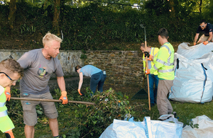 image of volunteers clearing vegetation