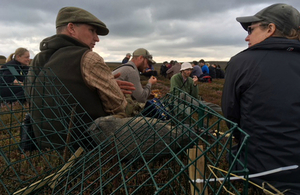 Two attendees at the training workshop discuss moorland management