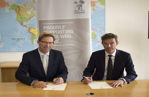 Defence Minister Tobias Ellwood and TechVets co-founder Mark Milton sign the Armed Forces Covenant.