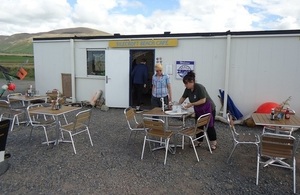 Sal Millar, left, and cafe operator Sam Burns, outside the new seafront cafe at Silecroft, with the Cumbrian fells as a backdrop