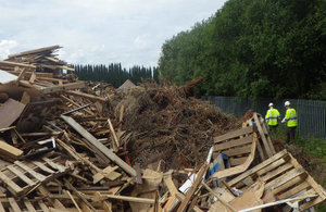 Environment Agency officers inspecting waste on the site