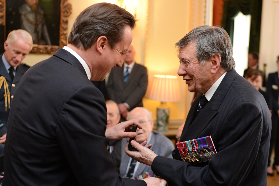 The Prime Minister awards a Bomber Command Clasp to a veteran 