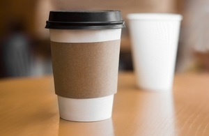 A disposable coffee cup on a table