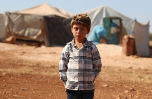 An internally displaced boy stands near his temporary shelter in rural Idlib, Syrian, August 2018. Picture: UNICEF/Amer Al Shami