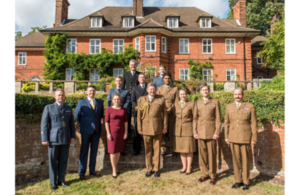 General Sir Chris Deverell and members of the JFC Staff who received awards pose for a group picture.