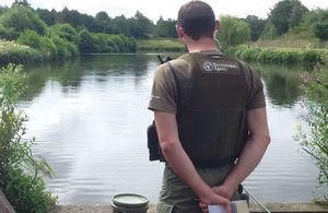 Environment Agency fisheries enforcement officer on a riverbank