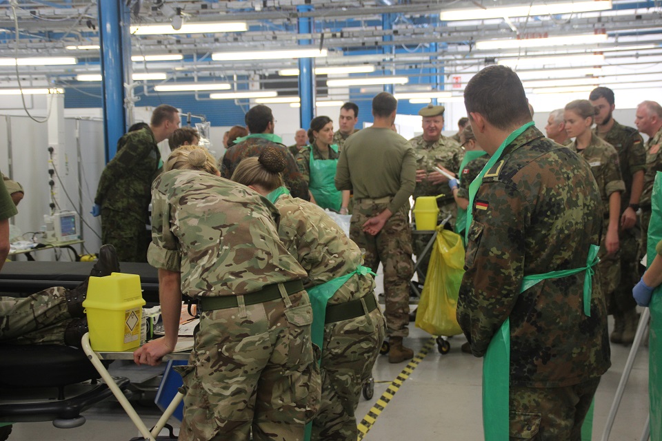 Familiarisation training in the ED Bay at AMSTC for troops from (L-R) Estonia (Defence Medical School), UK (205 Fd Hosp), US and Germany (Medical Regt 2). 