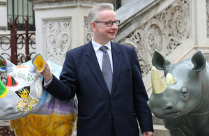 Environment Secretary, Michael Gove with Tusk Trust's rhino artworks