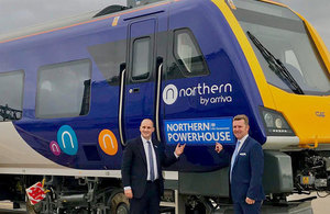 Picture of Jake Berry MP with David Brown in front of a Northern train.