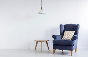 Blue armchair and wooden side table