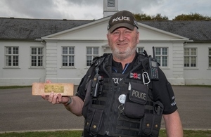 PC Paul Corcoran, or Coco, shown with one of the specially-inscribed bricks