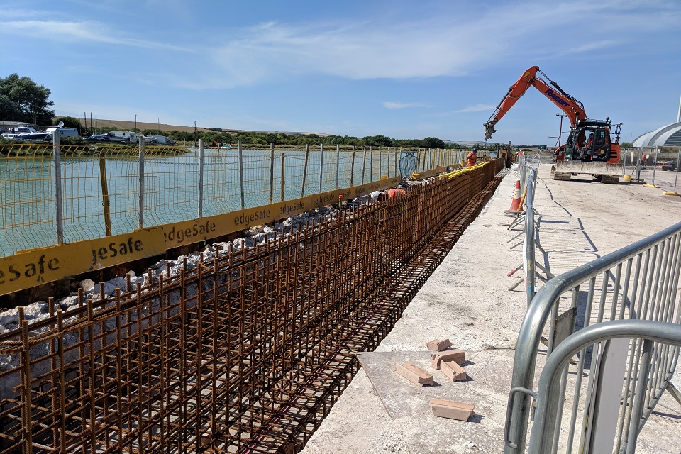 Construction of sheet-piled concrete flood wall along East Quay