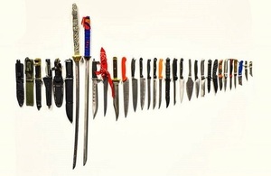 Knives of various styles in a row