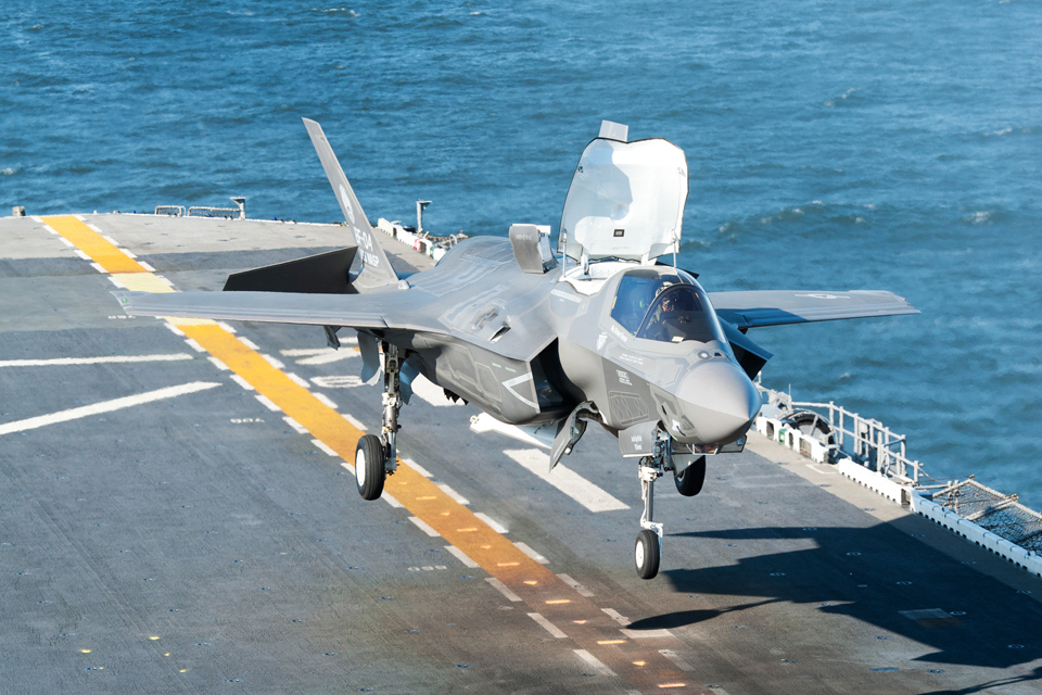 An F-35 Lightning II carries out a vertical landing on a US warship