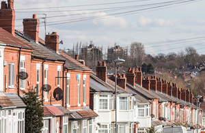 image showing a row of red brick houses