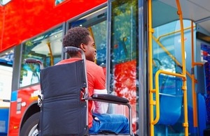 A wheelchair user boards a bus via Monkey Business Images via Shutterstock