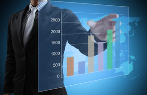 Man pointing at a bar chart