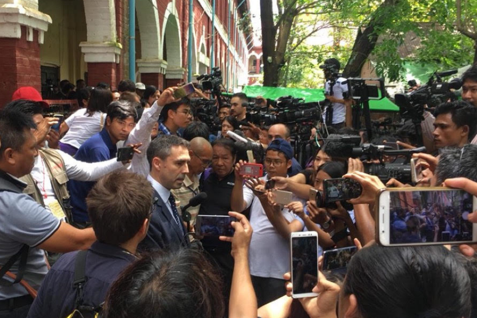 British Ambassador to Burma Dan Chugg giving a statement in the middle of a crowd.