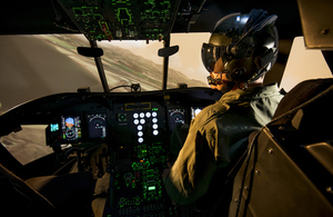 RAF pilot using the Chinook Mk 6 synthetic training facility.