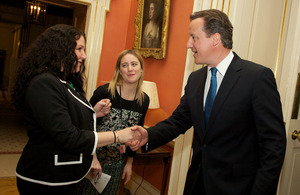 Prime Minister shaking hands with a community worker