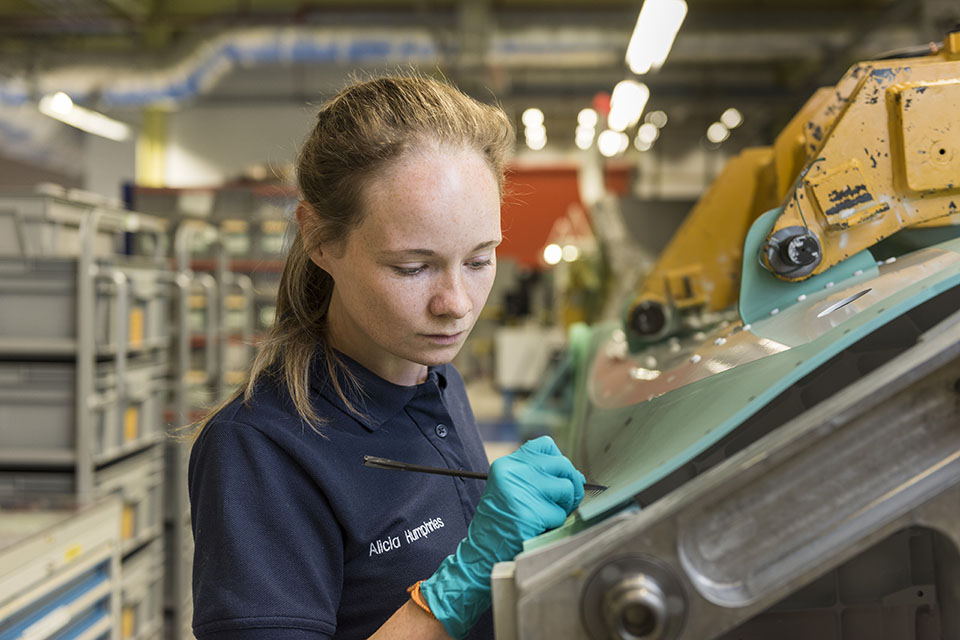 A&G Precision, Lancashire. A female employee working on a component for the F-35. 