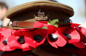 Royal Warwickshire cap amongst poppy wreath, Crown Copyright, All rights reserved