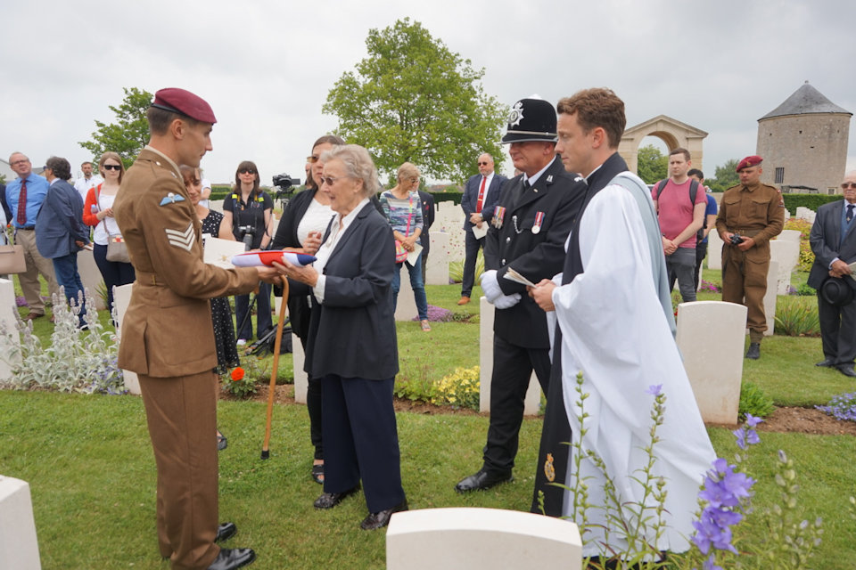 Private Tingle's sister, Margaret Keighley receives the Union Flag from Sergeant Gordon Judge, Crown Copyright, All rights reserved