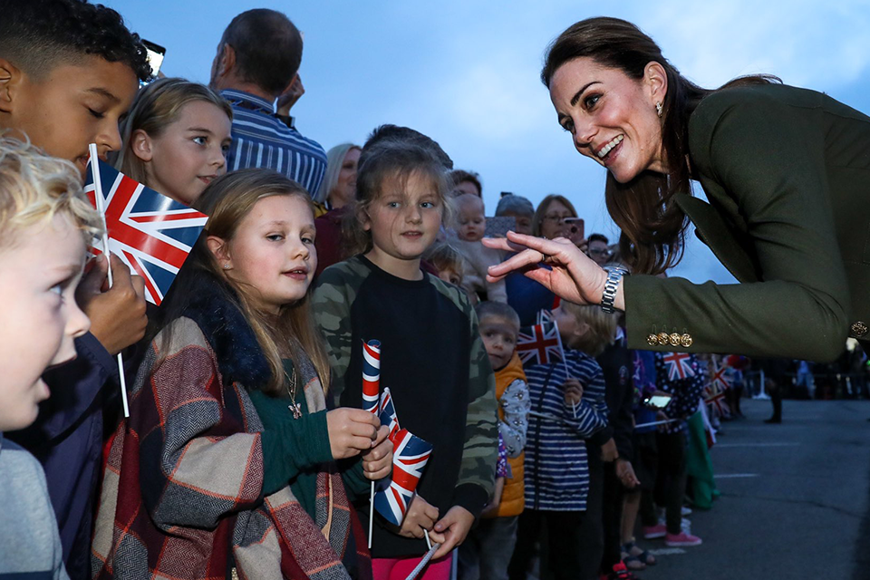 Her Royal Highness the Duchess of Cambridge meets with a group of children as part of the visit. 