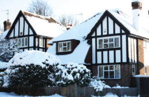 Detached mock Tudor house in snow