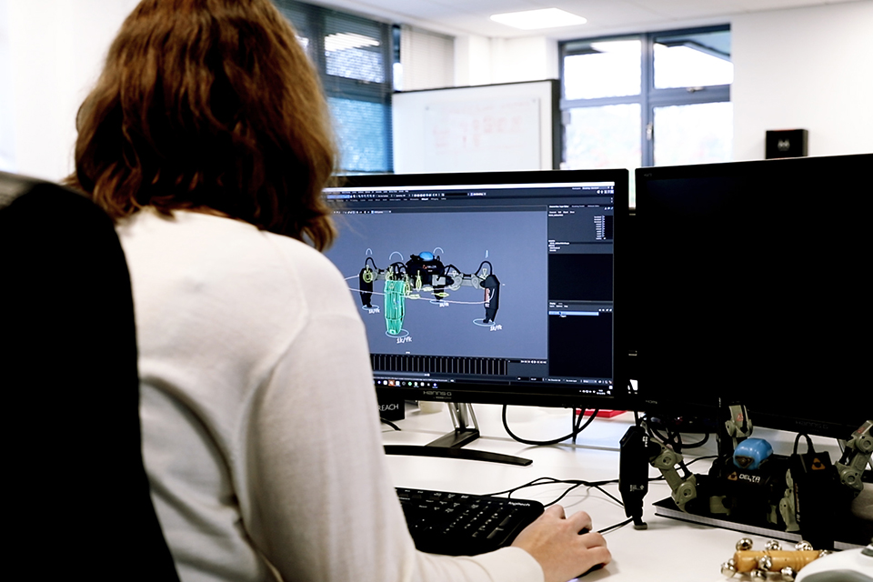 Female staff member working at a computer