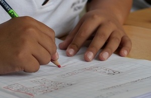 Child writing in workbook