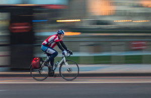 Image of cyclist on a city street.