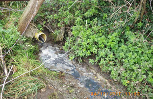 Pipe flowing into watercourse