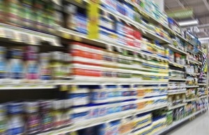 Blurred image of supermarket shelves.