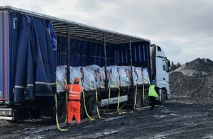 Workers prepare to offload Very Low Level Waste (VLLW) at licensed lanfill site.