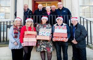 Sellafield Ltd apprentices handing over the gifts from the Shoe Box Appeal to AgeUK, Whitehaven.