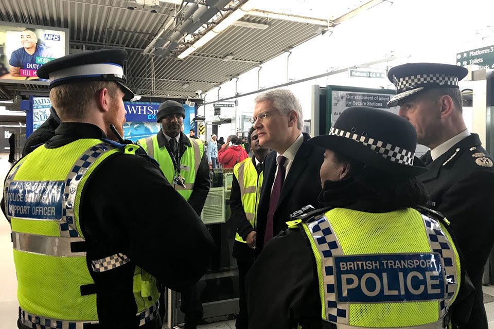 Minister Andrew Jones with British Transport police members.