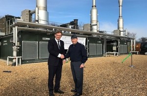 Tobias Ellwood in front of the new biogas facility which will power RAF Marham.