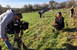 A BBC cameraman films the planting of trees in Nottinghamshire