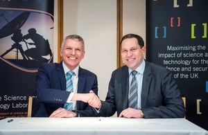 Photo caption, left to right: Dstl Chief Executive Gary Aitkenhead and DECA Chief Executive Geraint Spearing