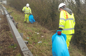 Collecting rubbish on the road verge