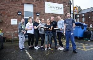 LLWR apprentices outside Calderwood House with Hostel Manager Steve Pettit,