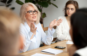 An image of women talking in a meeting