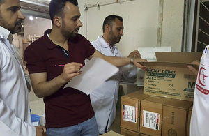ICRC and medical staff check donated supplies at a hospital in Gaza, 2018. ICRC/Rama Humeid