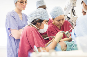 Surgeons operating on a patient