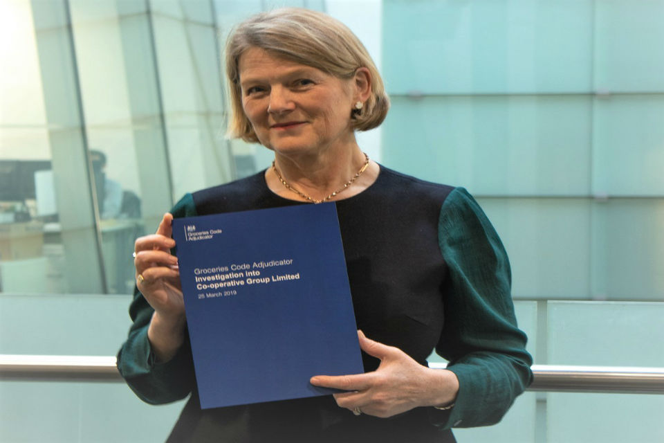 Christine Tacon holding a copy of the investigation report into Co-operative Group Limited. 