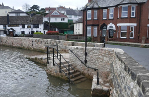 Newly built flood walls around the harbour in the village of Cockwood