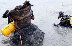 Military bomb disposal experts at work in the River Stour